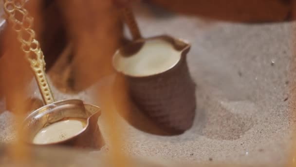 Turkish coffee cooked in sand — Stock Video