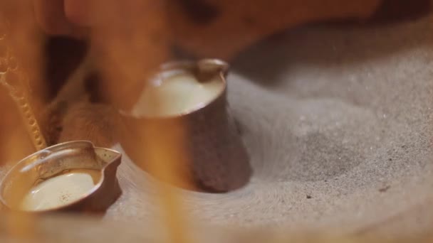 Turkish coffee cooked in sand — Stock Video