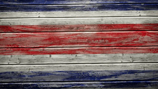 悬挂在风化木板上的哥斯达黎加国旗 — 图库照片