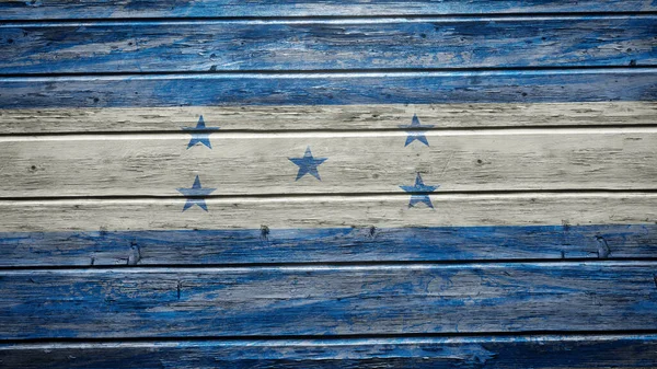 ホンジュラスの旗は風化した木板に描かれている — ストック写真