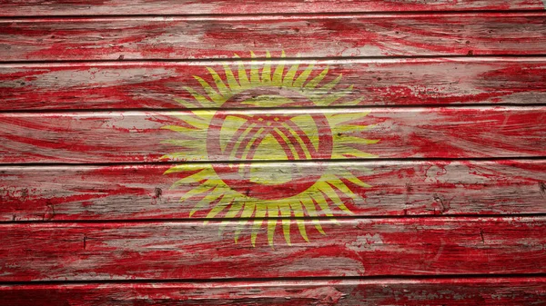 在风化木板上涂上吉尔吉斯斯坦国旗 — 图库照片