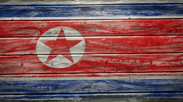 悬挂在风化木板上的朝鲜国旗 — 图库照片