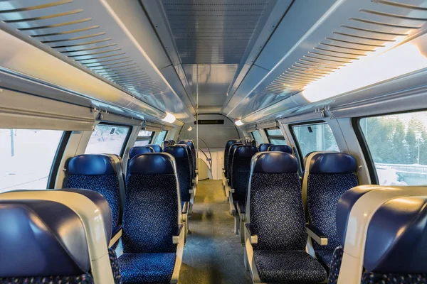 train's cabin, view of interior of a train, blue seats.