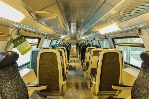train\'s cabin, view of interior of a train, blue seats.