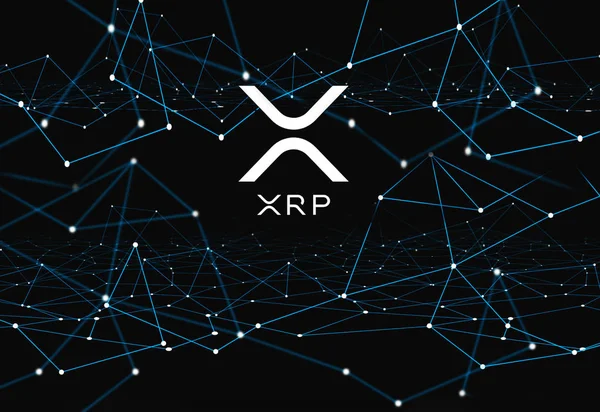 Сеть криптовалют Ripple XRP на синем фоне — стоковое фото