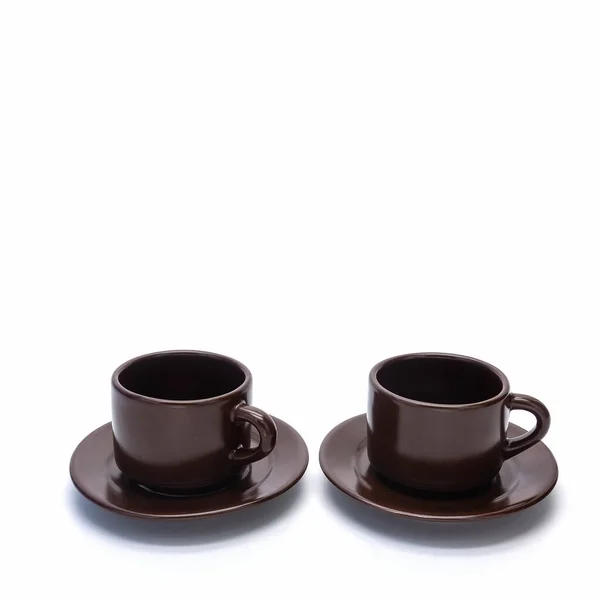Dwie Porcelanowe Filiżanki Kawy Talerze Stoją Obok Siebie Naczynia Brązowe — Zdjęcie stockowe