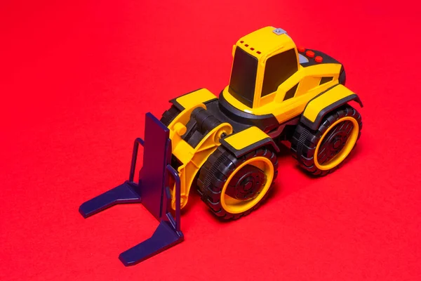 Жовтий Чорний Навантажувач Іграшок Червоному Тлі Трактор Будівельного Обладнання Дітей — стокове фото