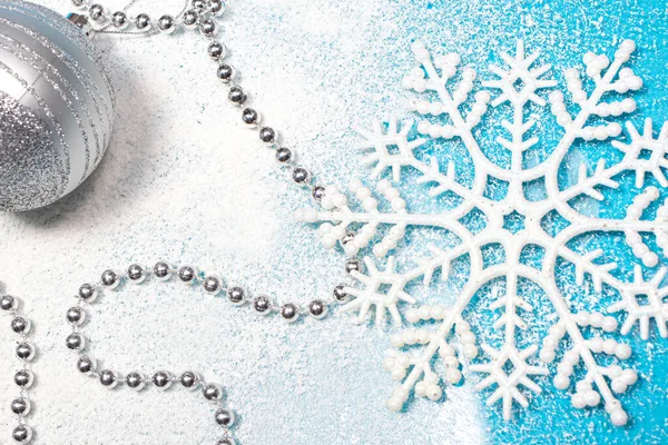 Snowflake Beads New Year Toy Snow Covered Blue Background Postcard — Stock Photo, Image