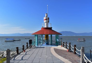 Lighthouse on the dock of Chapala Lake clipart