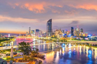 Brisbane city skyline and Brisbane river at twilight in Australia clipart