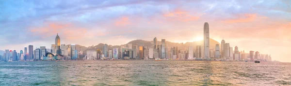 Hong Kong city skyline in China panorama from across Victoria Harbor.