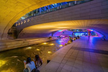 Cheonggyecheon, a modern public recreation space in downtown Seoul, South Korea at night