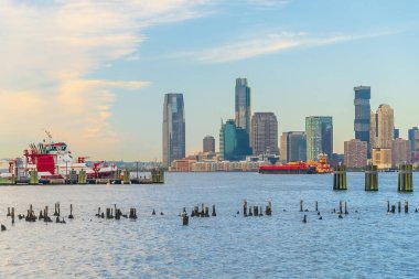 Cityscape of Jersey City skyline  from Manhattan New York City at sunrise