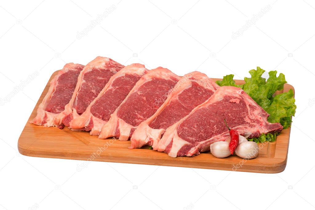 fresh and raw beef on cutting board on white background.