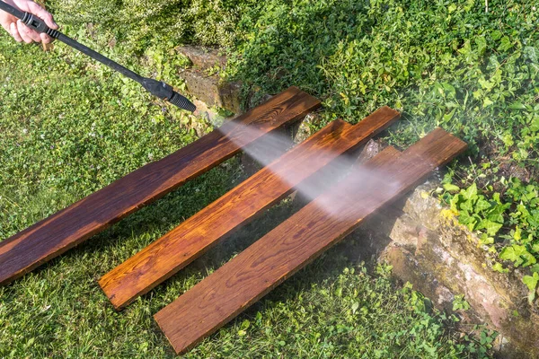 Cleaning Three Old Wooden Boards High Pressure Cleaner — Stock Photo, Image