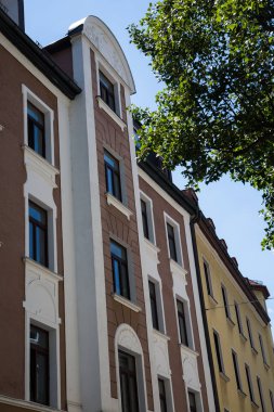 Old building and new building, row of houses in Schwabing clipart