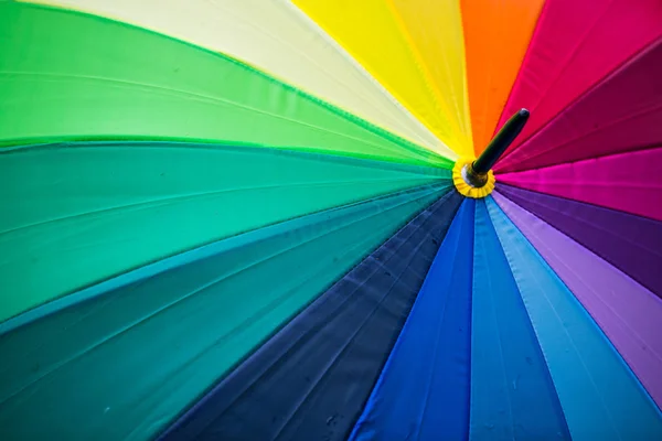 Umbrella with rainbow colors, symbolic, — Stock Photo, Image