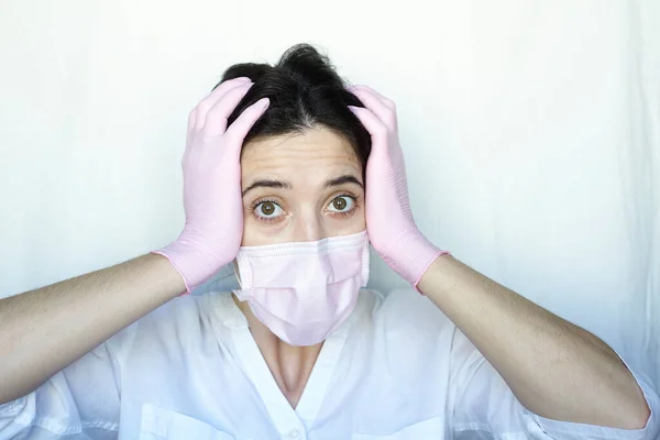 Woman Protective Mask Gloves White Background Holds Her Head Two — Stock Photo, Image