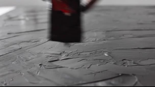 The process of applying putty on a horizontal surface — Stock Video