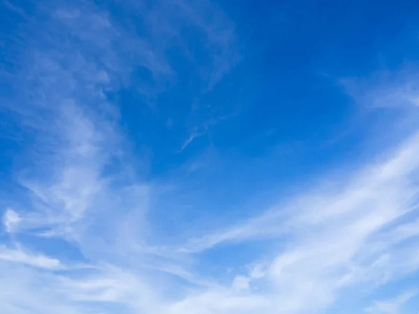 blue sky horizontal with beautiful cirrocumulus clouds in bright clear summer season, good weather for out door activity, skycap nature background