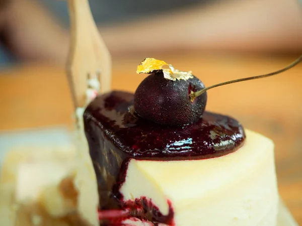 closeup tasty cherry cheese cake and fork in blurry background, coffee time break time food and drink or dessert concept