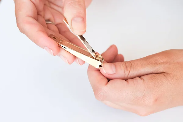 Woman Hands Using Nail Clippers Cut Her Fingernails White Background — Stock Photo, Image