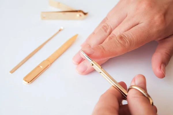 Woman Hands Using Small Scissors Cut Her Fingernails White Background — Stock Photo, Image