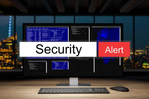 计算机工作站在黑夜办公室与天际线视图警告 — 图库照片
