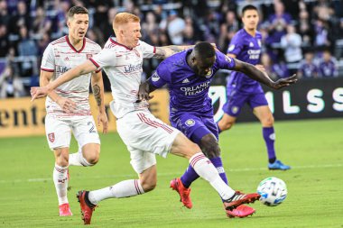 Orlando City SC oyuncusu Benji Michel # 19 ve Real Salt Lake oyuncusu Justen Glad # 15 maç Exploria Stadyumu 'nda 29 Şubat 2020.  