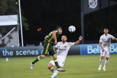 Los Angeles Galaksisi, 14 Temmuz 2020 'de Orlando Florida ABD' deki ESPN Vahşi Spor Dünyası 'nda düzenlenen MLS Sırt Turnuvası sırasında Portland Timbers ile karşı karşıya geldi.