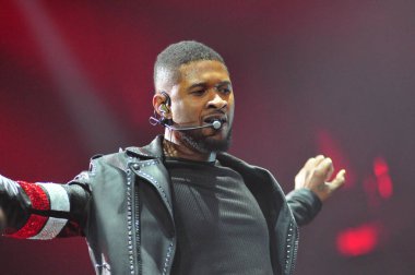 R&B Singer Usher performs at the Amway Center in Orlando Florida on December 12, 2015.  clipart