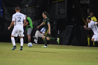 Los Angeles Galaksisi, 14 Temmuz 2020 'de Orlando Florida ABD' deki ESPN Vahşi Spor Dünyası 'nda düzenlenen MLS Sırt Turnuvası sırasında Portland Timbers ile karşı karşıya geldi.