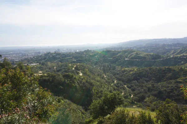 View of Los Angeles hills,  roads between hills and cityscape