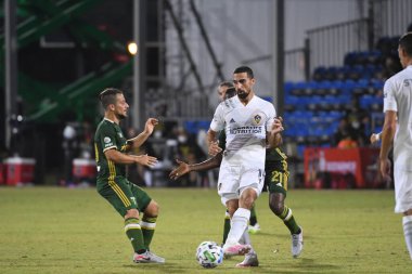 Los Angeles Galaksisi, 14 Temmuz 2020 'de Orlando Florida ABD' deki ESPN Vahşi Spor Dünyası 'nda düzenlenen MLS Sırt Turnuvası sırasında Portland Timbers ile karşı karşıya geldi.
