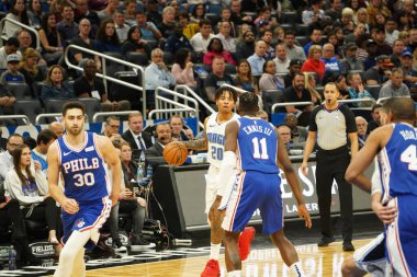 Orlando Magic 27 Aralık 2019 Cuma günü Orlando, Florida 'daki Amway Arena' da Philadelphia 76ers 'a ev sahipliği yapıyor..