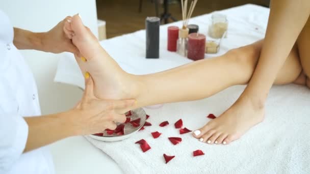 Foot massage of the client in the spa center. Medicine and health. Relax — Stock Video