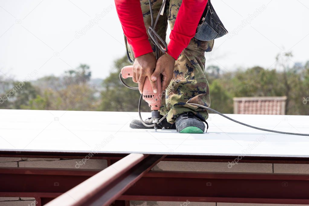 Man working on roof Metal cheese in site construction