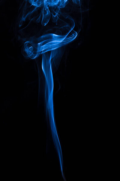 Blue and white smoke isolated on black background