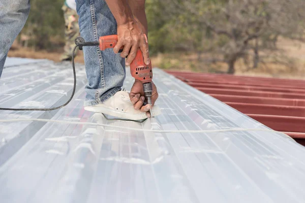 Man working on roof Metal cheese in site construction