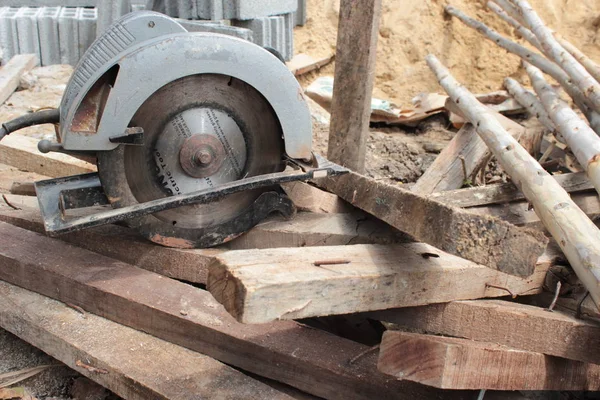 Electric circular saw cutting wood