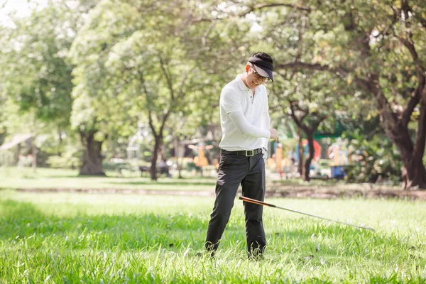 Asian men angry golfer trying to break his club