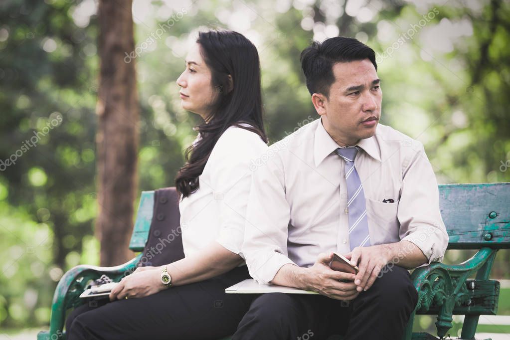 Asian business couple angry in the park,Business couple concept
