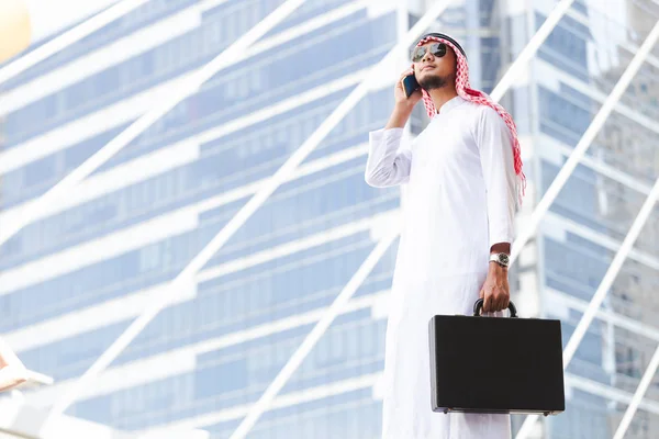 Arab business man call phone working in the city