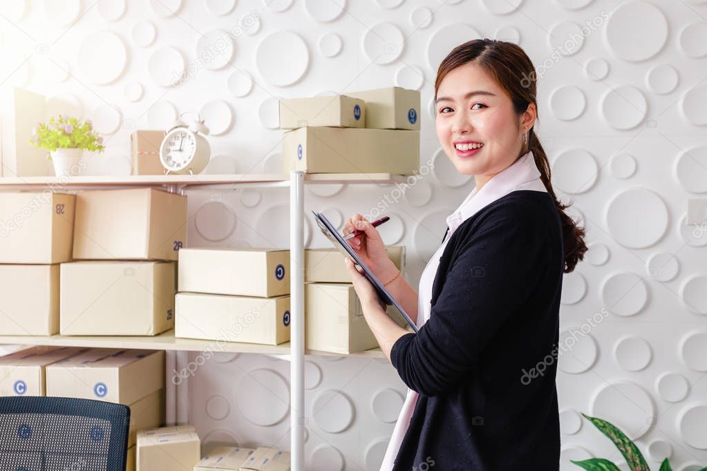 Portrait Asian young women standing smile in home office,Start up small business SME
