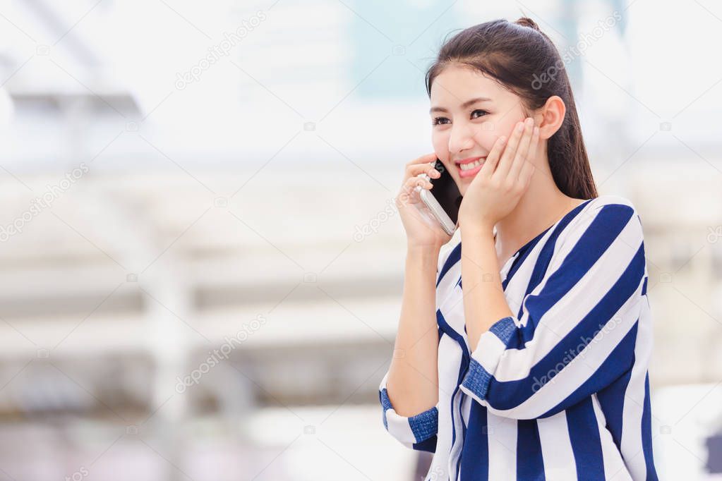 Businesswoman worker talking on smartphone