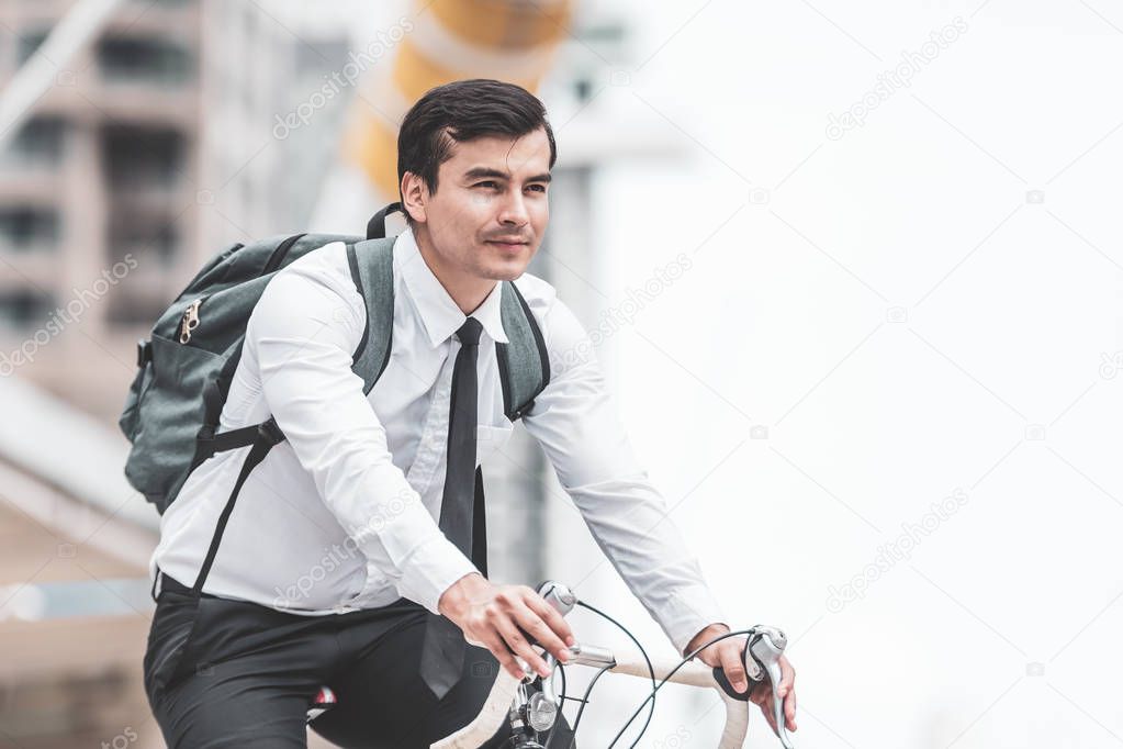 Businessmen riding bicycles