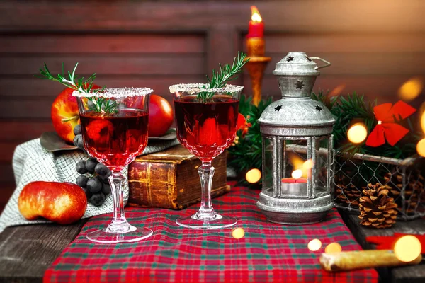 Christmas still life , two glass with red raspberry beverage decorated with rosemary , vintage old fashion style. — Stock Photo, Image