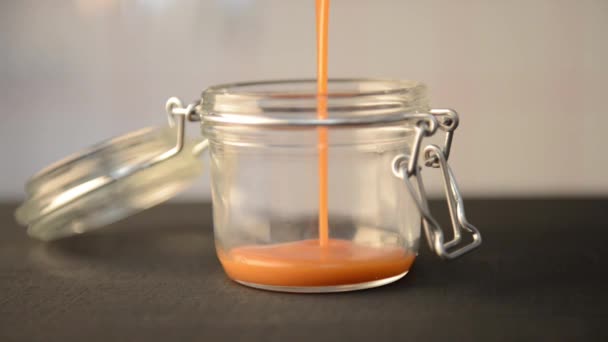Process Filling Glass Jar Liquid Sugar Caramel Black Wooden Kitchen — Stock Video