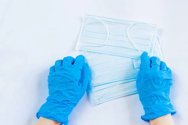 Blue medical masks. Personal protective equipment. Close-up. Place for an inscription.