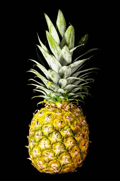 close-up of pineapple on a black background